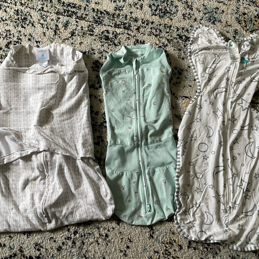 Bundle of swaddles, including Halo and Happiest Baby
